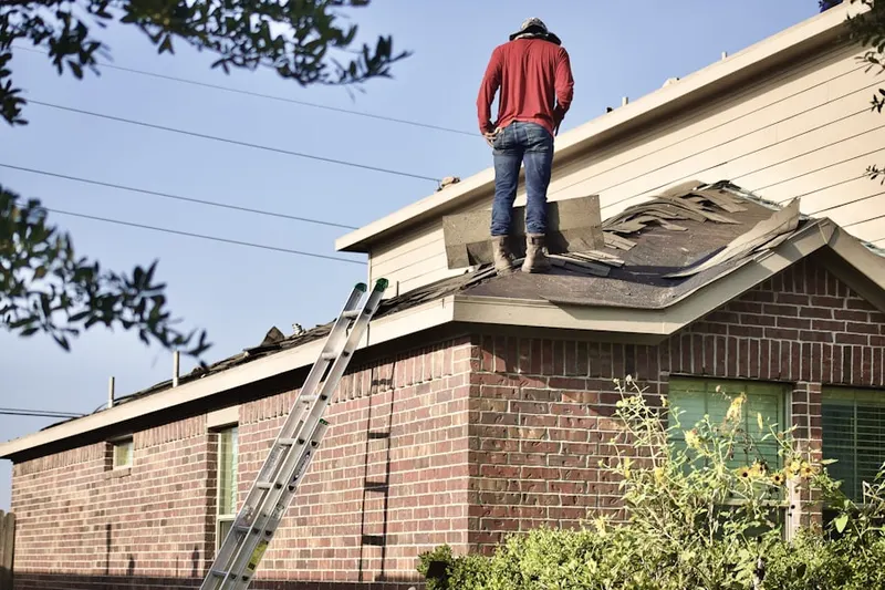 Professional roofer working on a residential roof in Washington Crossing
